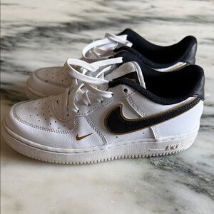 Nike White Sneakers with Black and Gold Details